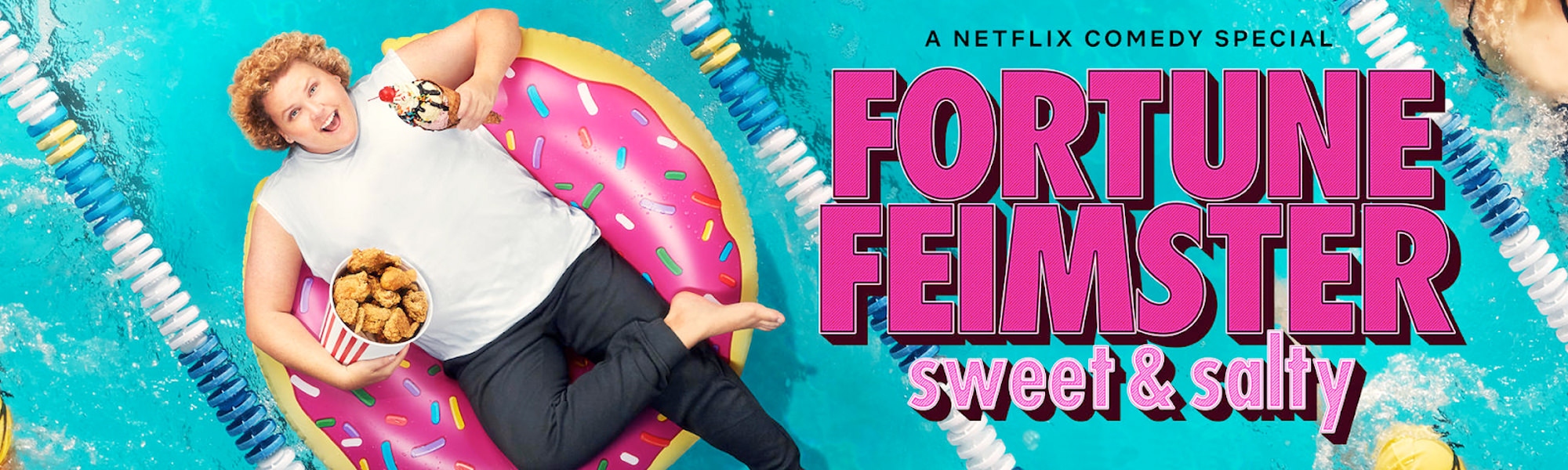 Comedian Fortune Feimster laying in a large inflatable donut floating in a swimming pool. The words Fortune Feimster Sweet and Salty, a Netflix Comedy Special appear in pink.